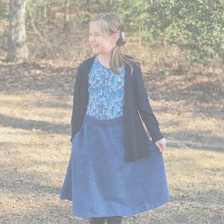 Girls Modeling an adjustable denim skirt and custom sewn shirt