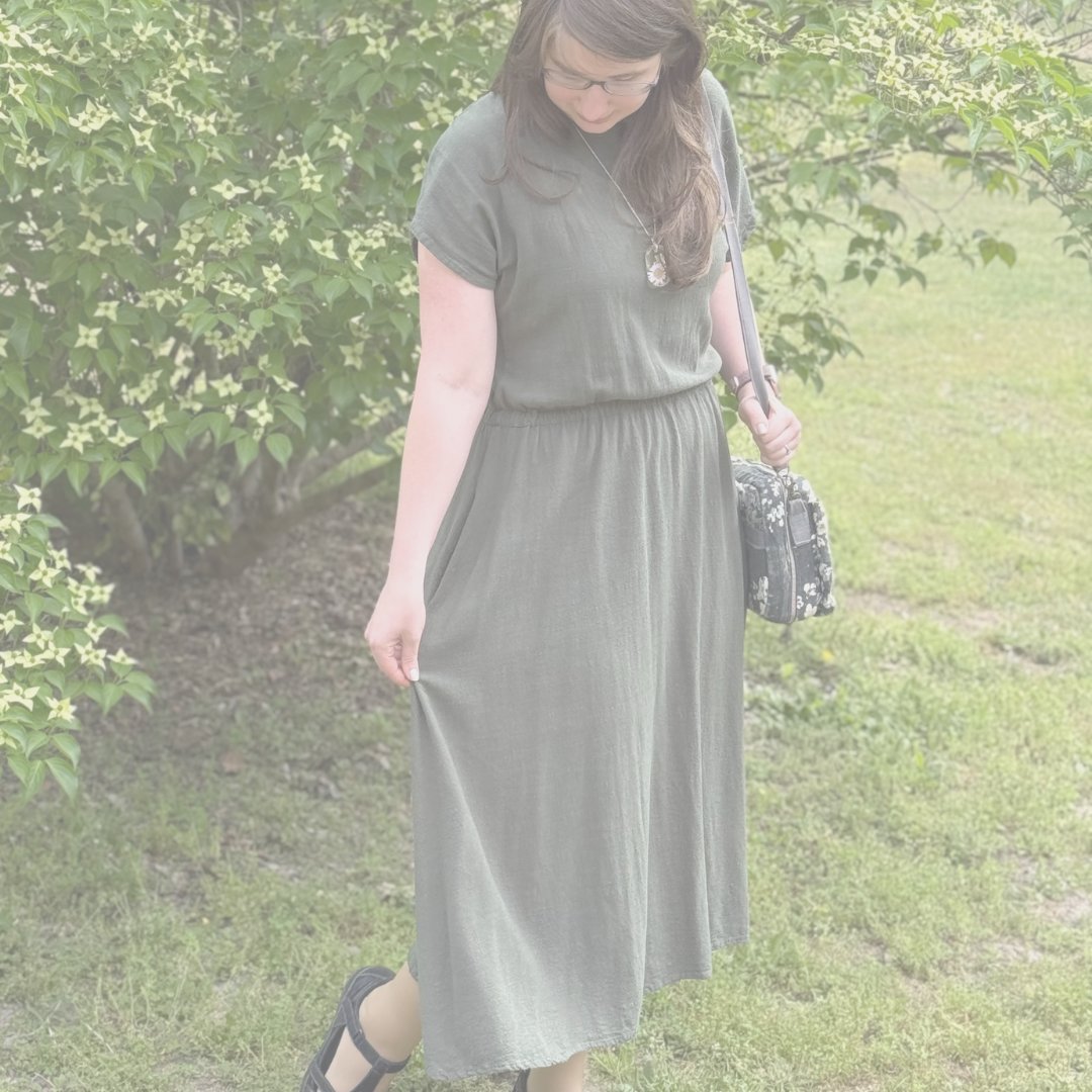 Woman modeling custom sewn smocked denim dress and tote bag